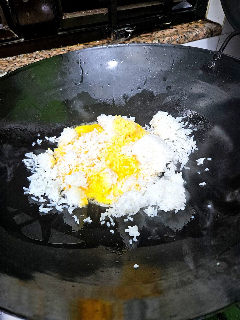 Add the rice to the half-cooked eggs