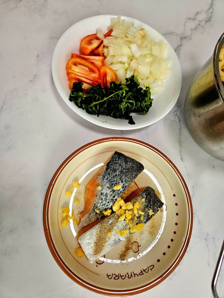 Cutting vegetables and seasoning salmon