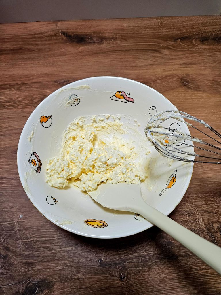 Beating cream cheese and butter