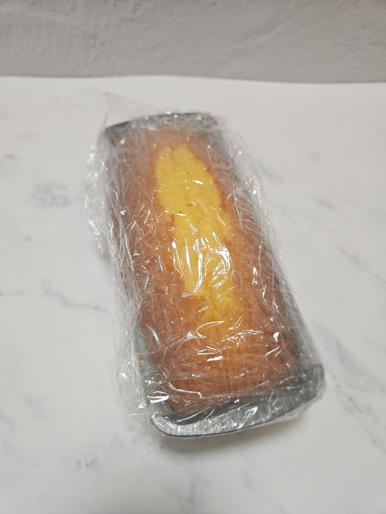 Plastic wrapping the cake